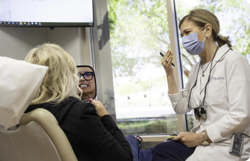 Dr. Laurie explaining procedure to patient