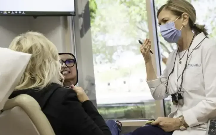 Dr. Laurie explaining procedure to patient - Exceptional Dentistry Dr. Laurie explaining procedure to patient