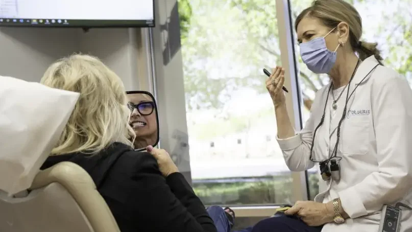 Dr. Laurie explaining procedure to patient